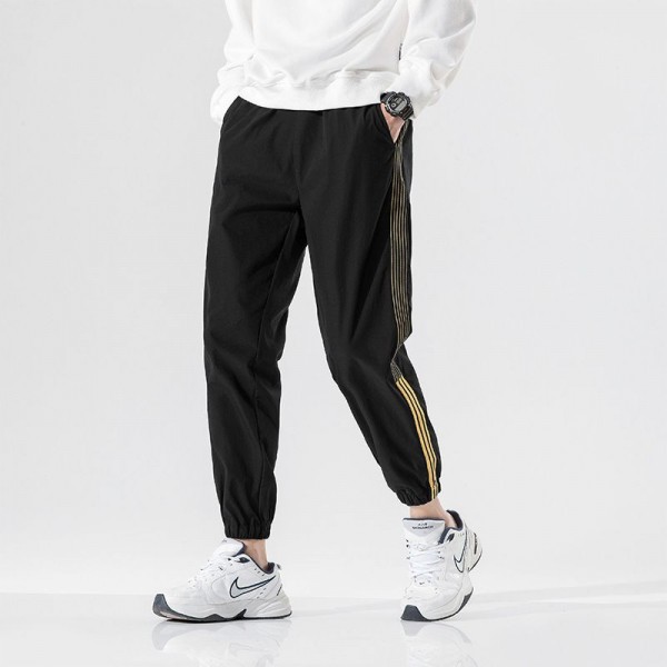 Autumn casual pants men's Korean fashion loose 9-point toe binding fashion brand versatile 3-bar sports pants men's